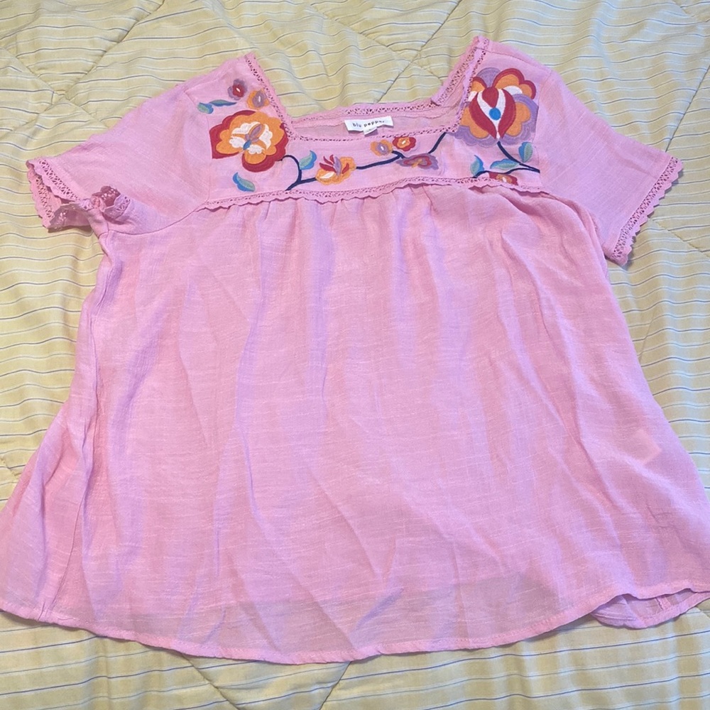 Pink blouse with embroidered flowers